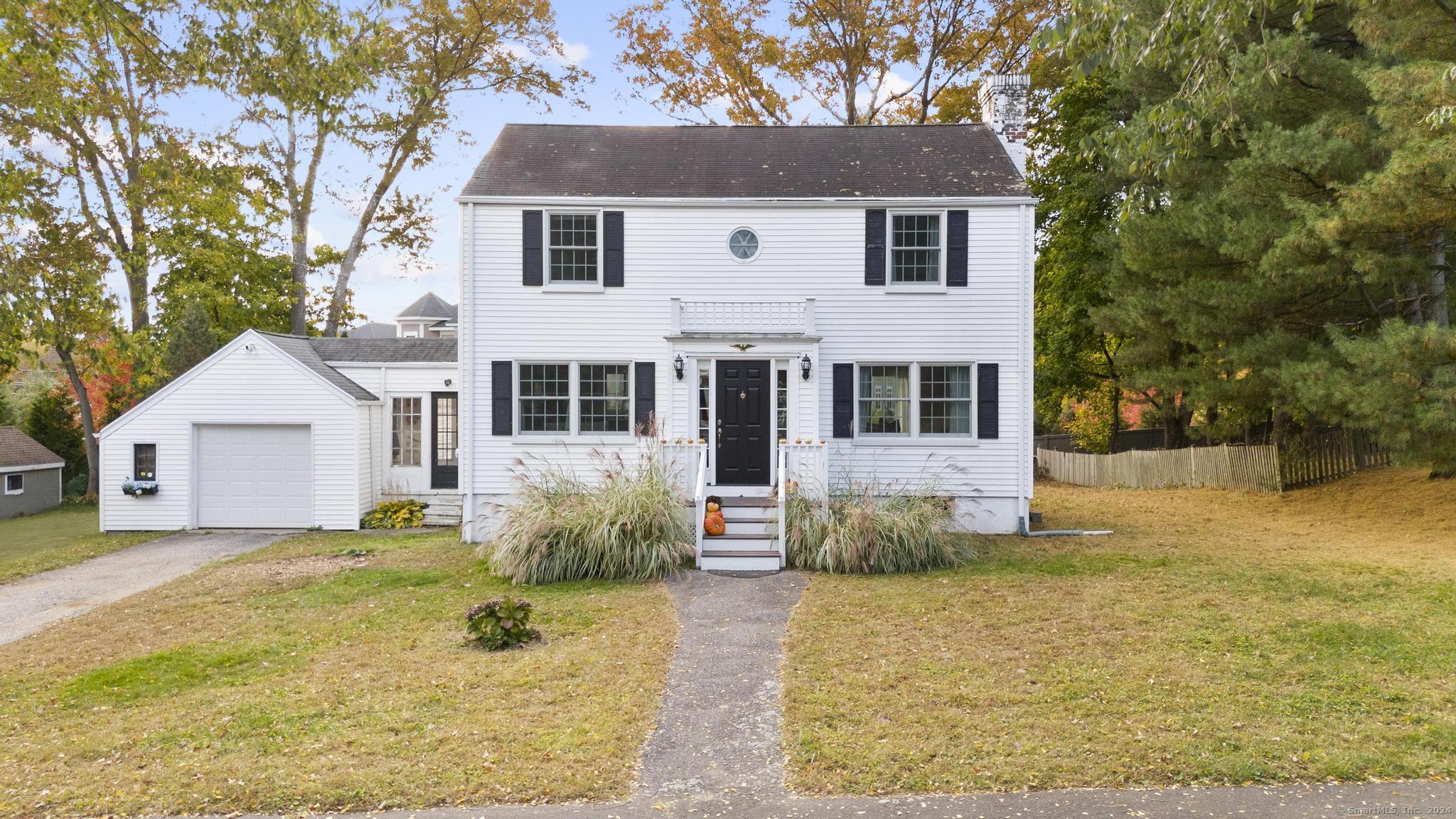43 Argonne Street Fairfield, CT 06825 - Photo 1 of 1 a front view of a house with a yard