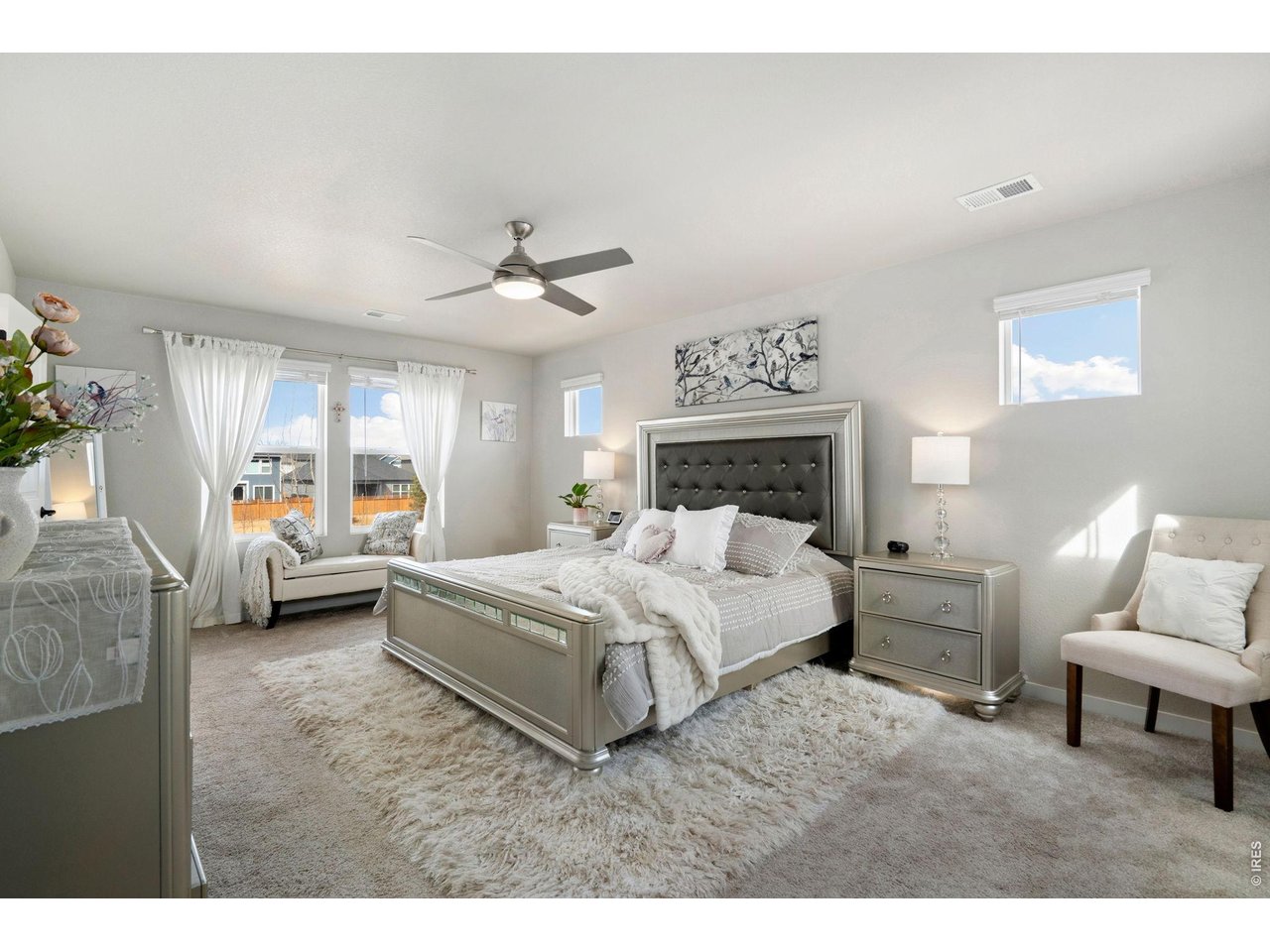 4433 Haymill Court Timnath, CO 80547 - Photo 23 of 39 a bedroom with a bed and a couch