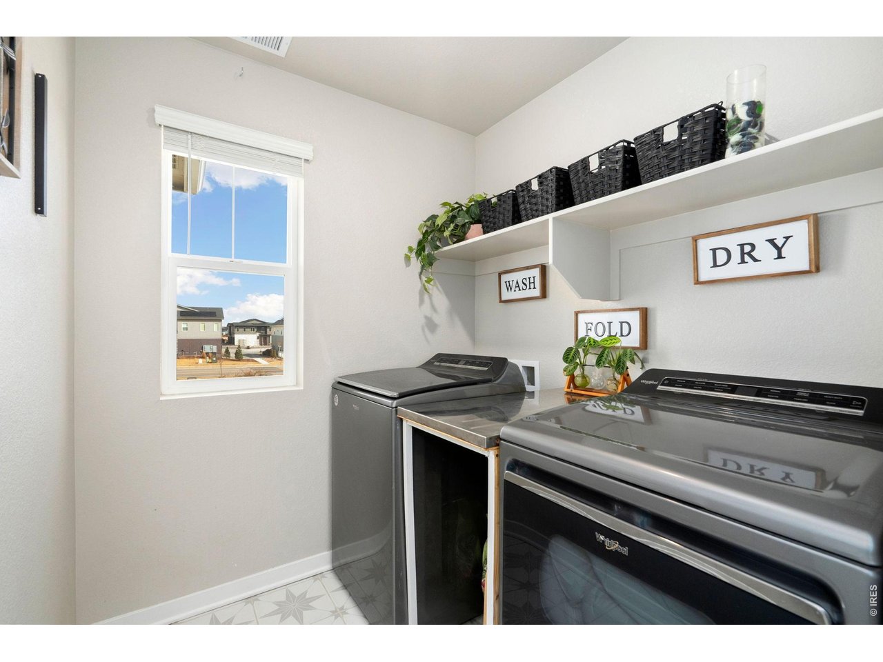 4433 Haymill Court Timnath, CO 80547 - Photo 30 of 39 a kitchen with a stove and a microwave
