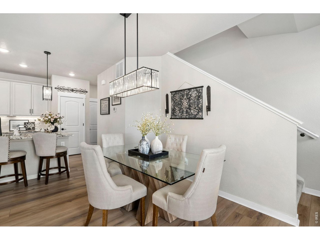 4433 Haymill Court Timnath, CO 80547 - Photo 8 of 39 a view of a dining room with furniture and wooden floor