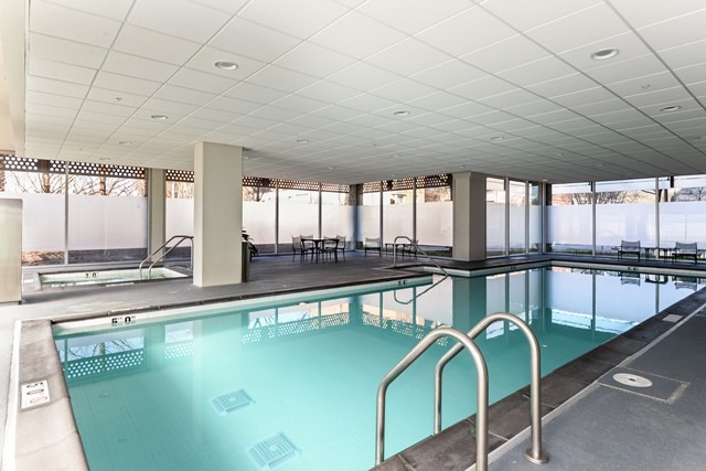800 Elgin Road, Unit 1210 Evanston, IL 60201 - Photo 13 of 15 a view of a swimming pool with a chairs