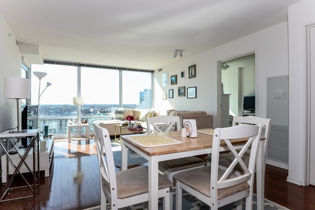 800 Elgin Road, Unit 1210 Evanston, IL 60201 - Photo 6 of 15 a view of a dining room with furniture and wooden floor