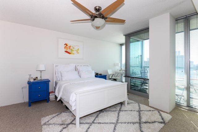 800 Elgin Road, Unit 1210 Evanston, IL 60201 - Photo 7 of 15 a bedroom with a bed and a window
