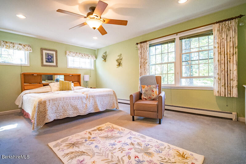 39 Pixley Road Monterey, MA 01230 - Photo 12 of 31 a bedroom with a bed and wooden floor