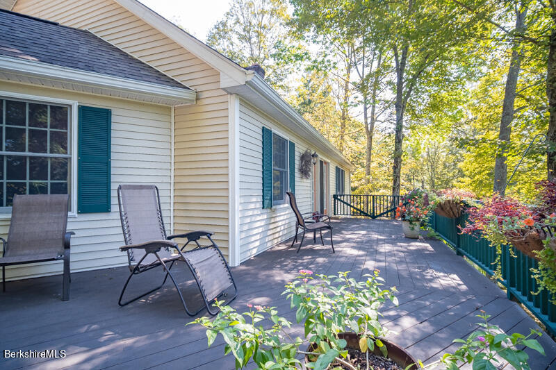 39 Pixley Road Monterey, MA 01230 - Photo 15 of 31 a view of a backyard with furniture and a patio