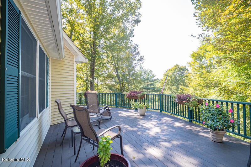 39 Pixley Road Monterey, MA 01230 - Photo 16 of 31 a view of a table and chairs in the balcony