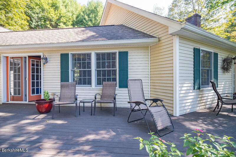 39 Pixley Road Monterey, MA 01230 - Photo 18 of 31 a view of a patio with table and chairs and potted plants