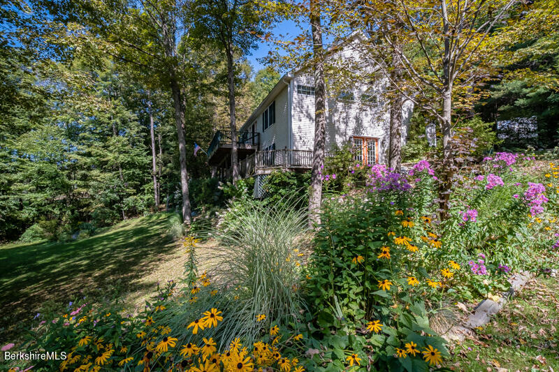 39 Pixley Road Monterey, MA 01230 - Photo 2 of 31 a view of a flower in a yard