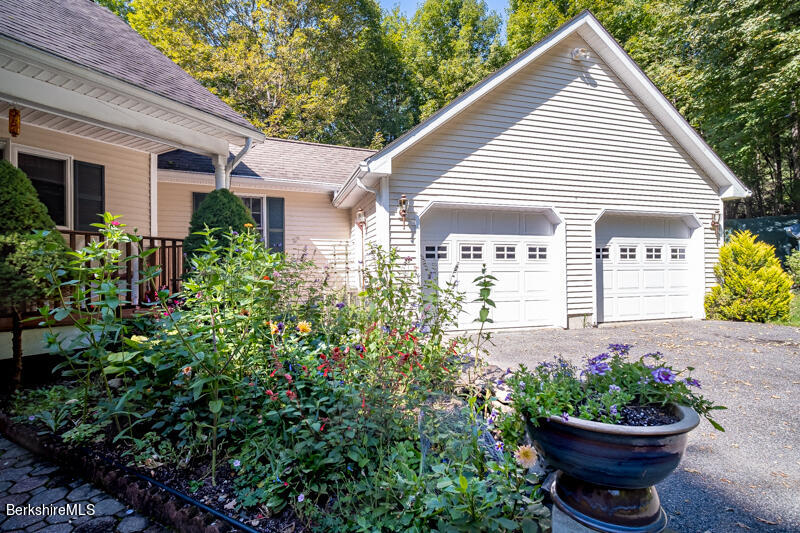 39 Pixley Road Monterey, MA 01230 - Photo 3 of 31 a view of a house with a flower garden