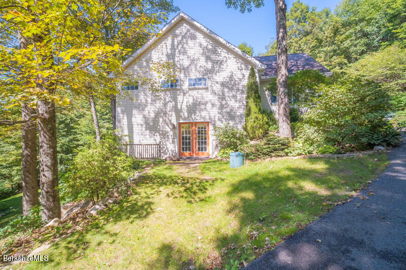 39 Pixley Road Monterey, MA 01230 - Photo 29 of 31 a view of a yard in front of a house with large trees
