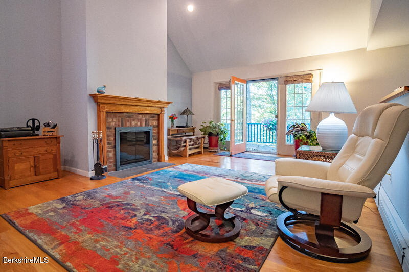 39 Pixley Road Monterey, MA 01230 - Photo 5 of 31 a living room with furniture a fireplace and next to a window