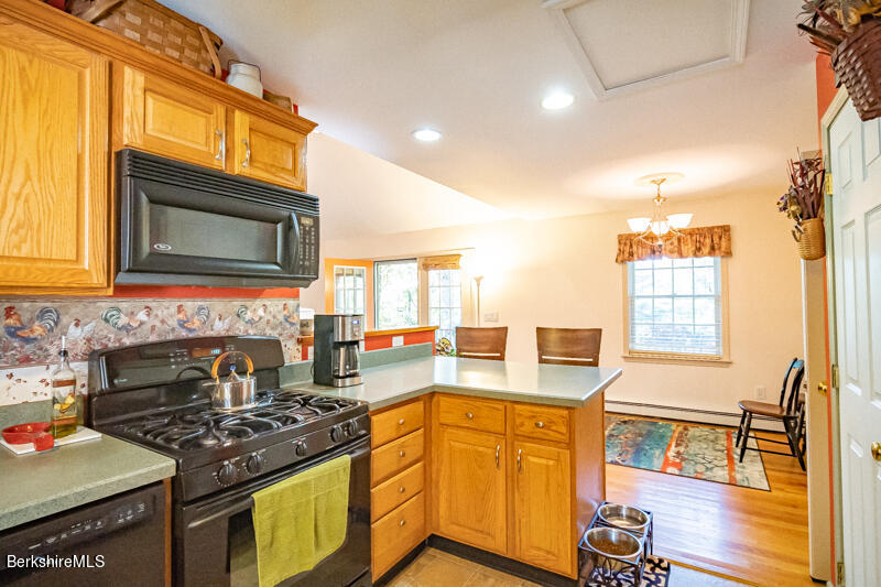 39 Pixley Road Monterey, MA 01230 - Photo 9 of 31 a kitchen with stainless steel appliances granite countertop a stove a sink and a microwave