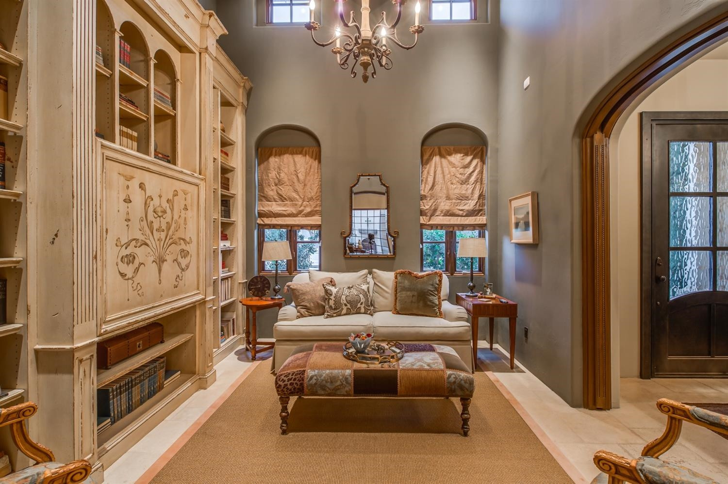4106 103rd Street Lubbock, TX 79423 - Photo 4 of 10 a living room with furniture a chandelier and entryway
