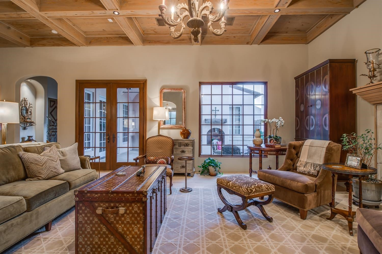 4106 103rd Street Lubbock, TX 79423 - Photo 7 of 10 a living room with furniture a chandelier and a piano