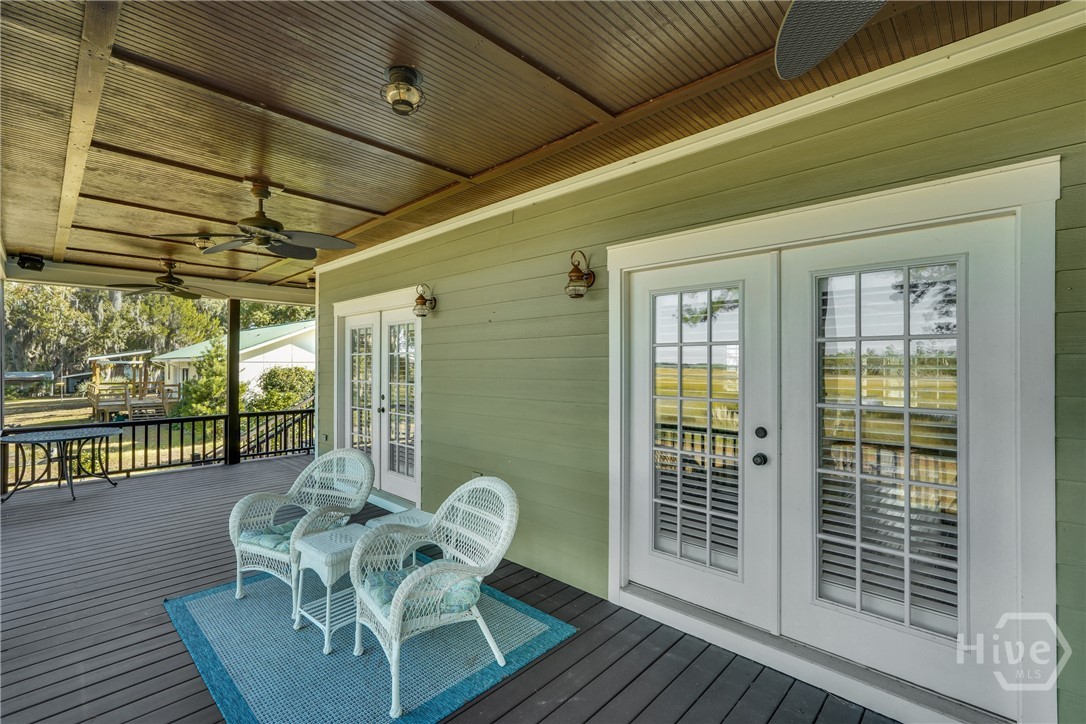 1261 Otter Slide Loop Townsend, GA 31331 - Photo 11 of 47 Pack porch overlooking the peaceful and everchanging marsh view.