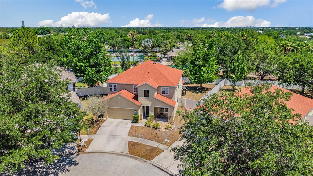 10945 Subtle Trail Drive Riverview, FL 33579 - Photo 1 of 51 an aerial view of a house with a garden and yard