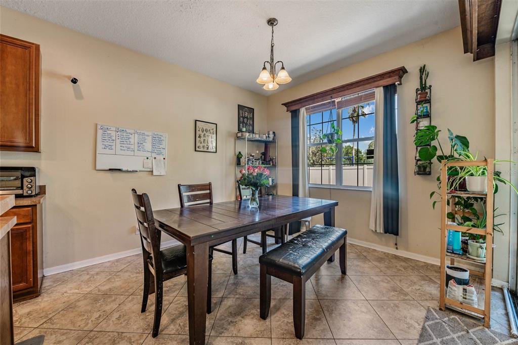 10945 Subtle Trail Drive Riverview, FL 33579 - Photo 18 of 51 a view of a dining room with furniture window and wooden floor