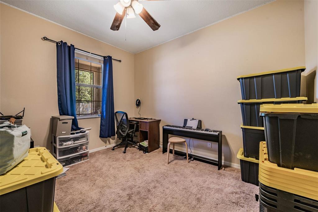 10945 Subtle Trail Drive Riverview, FL 33579 - Photo 19 of 51 a bedroom with furniture and a window
