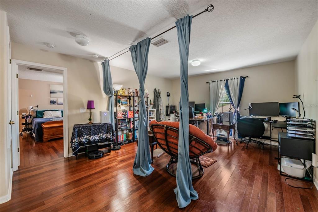 10945 Subtle Trail Drive Riverview, FL 33579 - Photo 23 of 51 a living room with furniture and a wooden floor