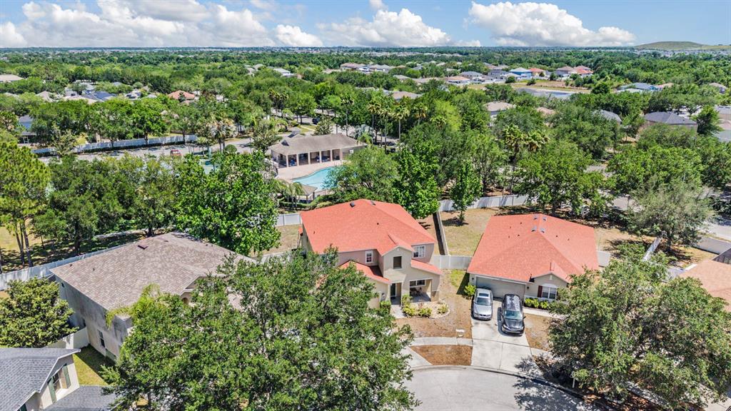 10945 Subtle Trail Drive Riverview, FL 33579 - Photo 40 of 51 an aerial view of a house with a garden and lake view
