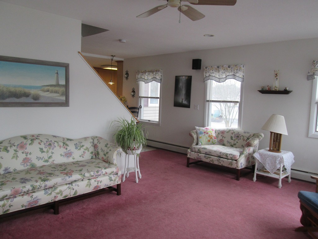 334 Killdeer Road Webster, MA 01570 - Photo 11 of 28 a living room with furniture and a window