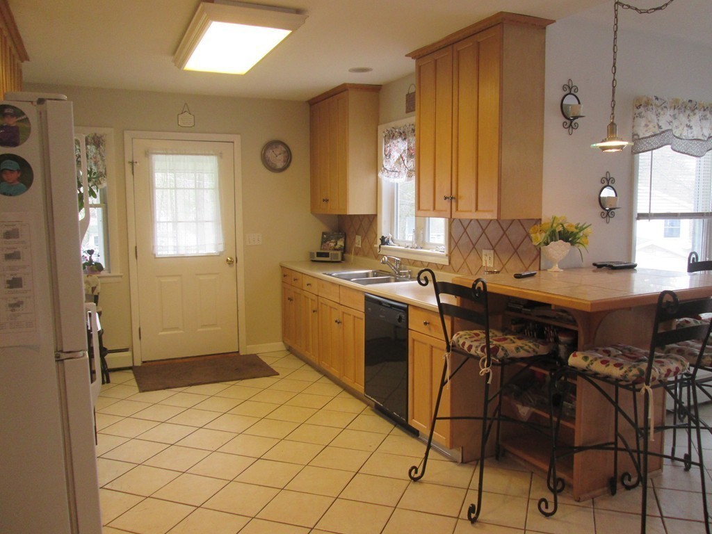334 Killdeer Road Webster, MA 01570 - Photo 12 of 28 a kitchen with a sink cabinets and appliances