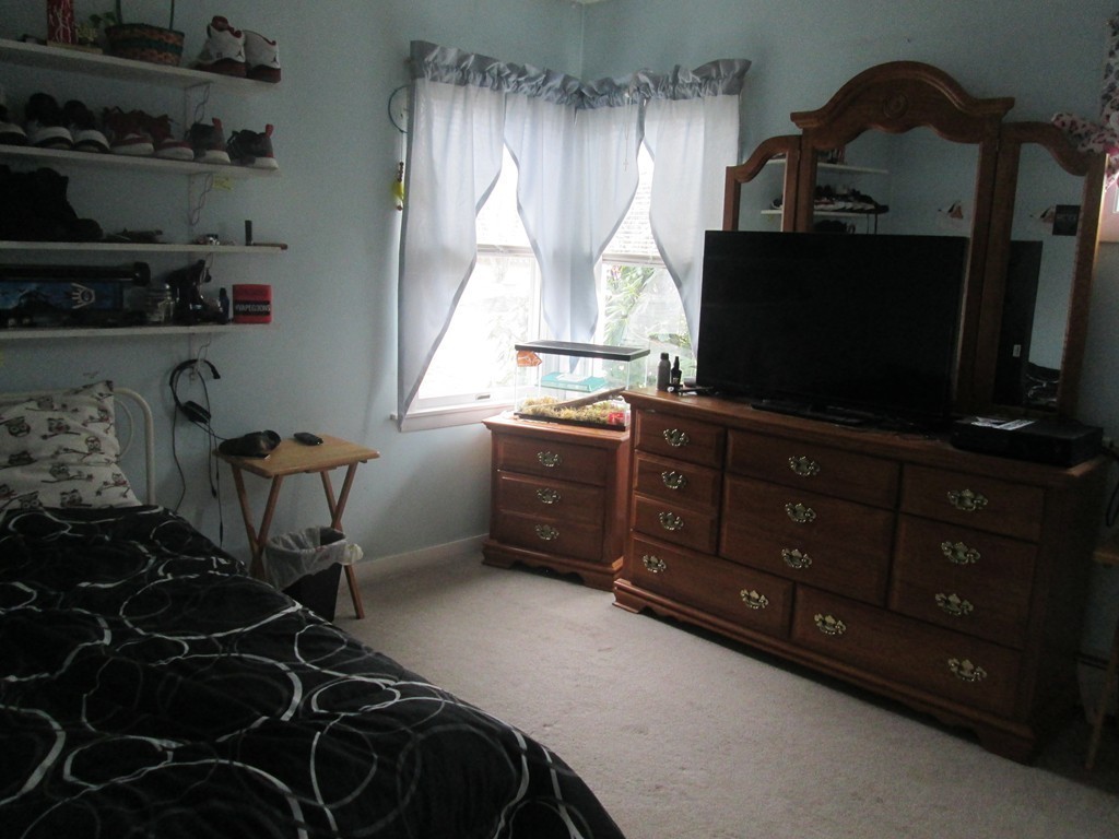 334 Killdeer Road Webster, MA 01570 - Photo 17 of 28 a room with furniture and flat screen tv