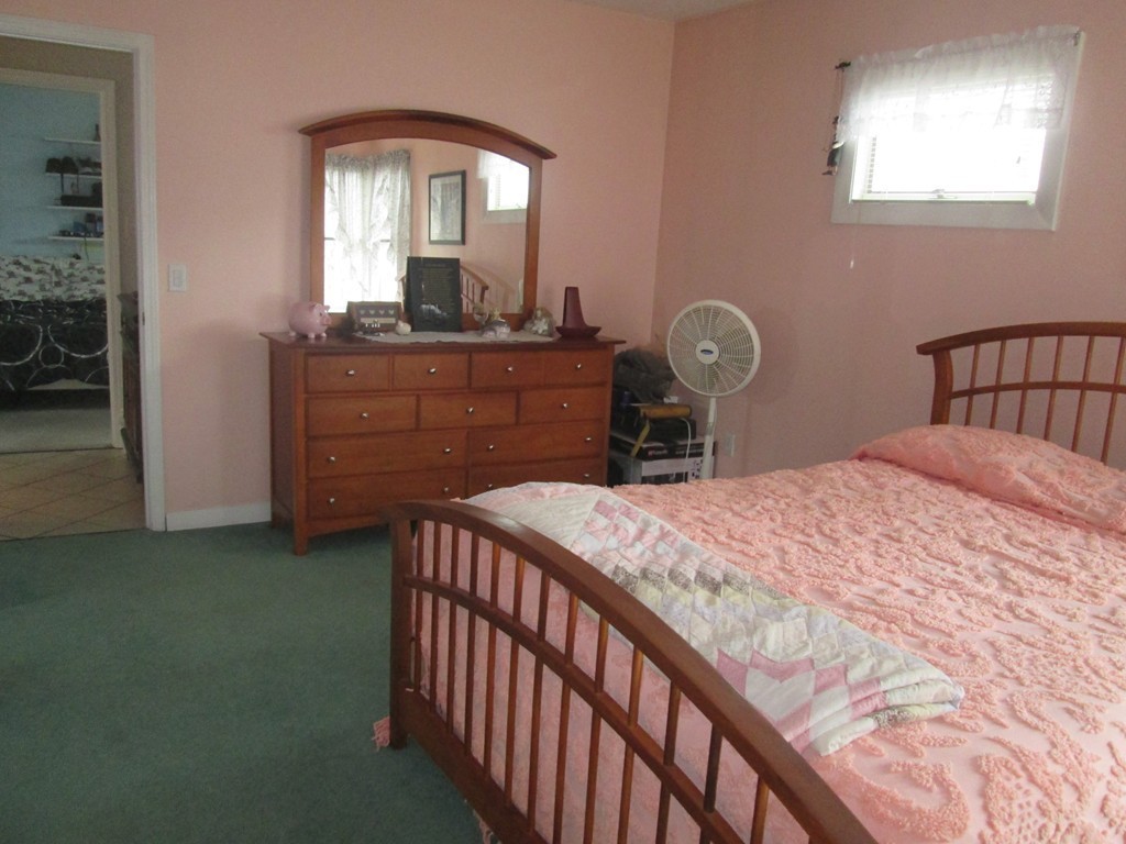 334 Killdeer Road Webster, MA 01570 - Photo 19 of 28 a bedroom with a bed and a dresser