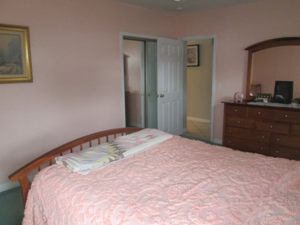 334 Killdeer Road Webster, MA 01570 - Photo 20 of 28 a bedroom with a bed and a flat screen tv