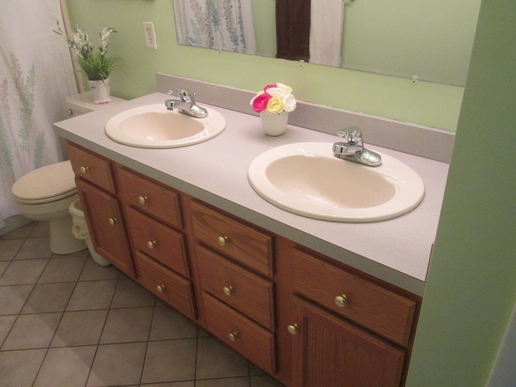 334 Killdeer Road Webster, MA 01570 - Photo 27 of 28 a bathroom with a sink and a mirror