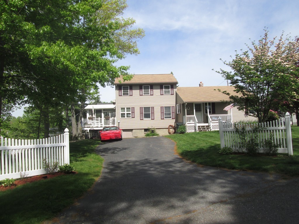 334 Killdeer Road Webster, MA 01570 - Photo 4 of 28 a front view of a house with a garden