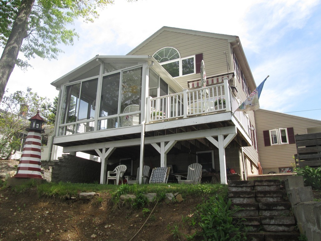 334 Killdeer Road Webster, MA 01570 - Photo 6 of 28 a front view of a house with a yard