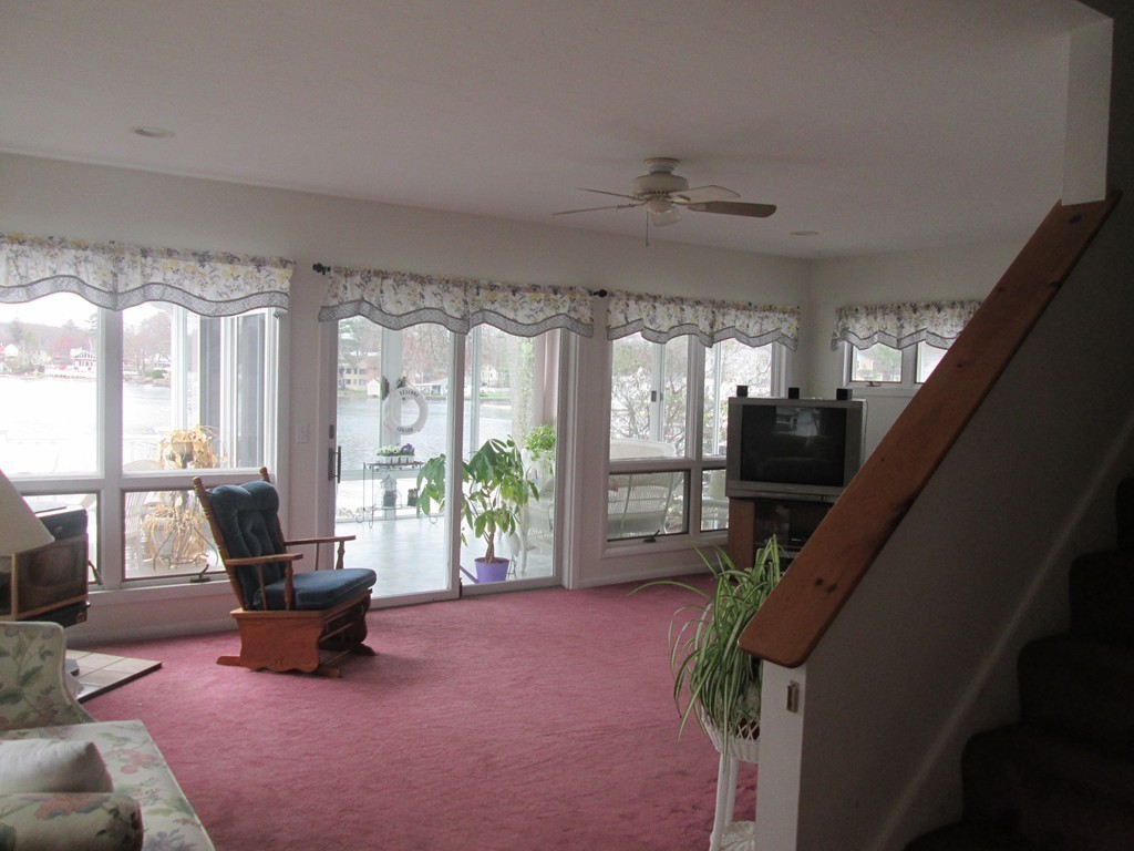 334 Killdeer Road Webster, MA 01570 - Photo 8 of 28 a living room with furniture and a large window