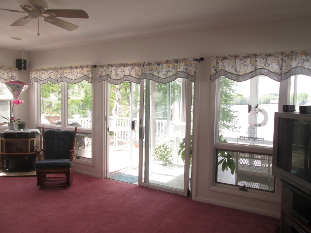 334 Killdeer Road Webster, MA 01570 - Photo 9 of 28 a living room with furniture and a fireplace