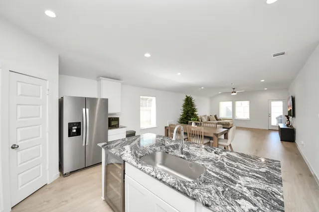 a view of a kitchen and dining room