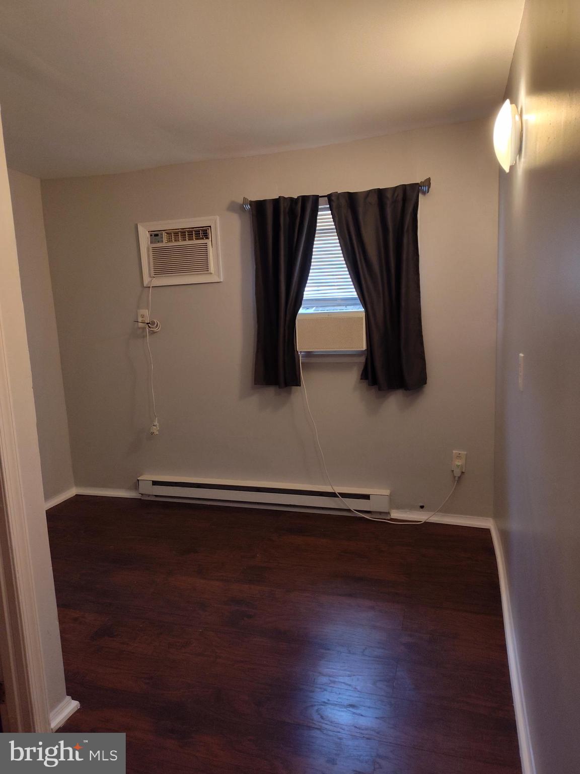 1607 Page Street Philadelphia, PA 19121 - Photo 11 of 14 a view of room with wooden floor and window