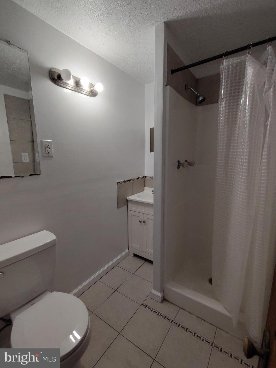 1607 Page Street Philadelphia, PA 19121 - Photo 5 of 14 a bathroom with a toilet and a shower