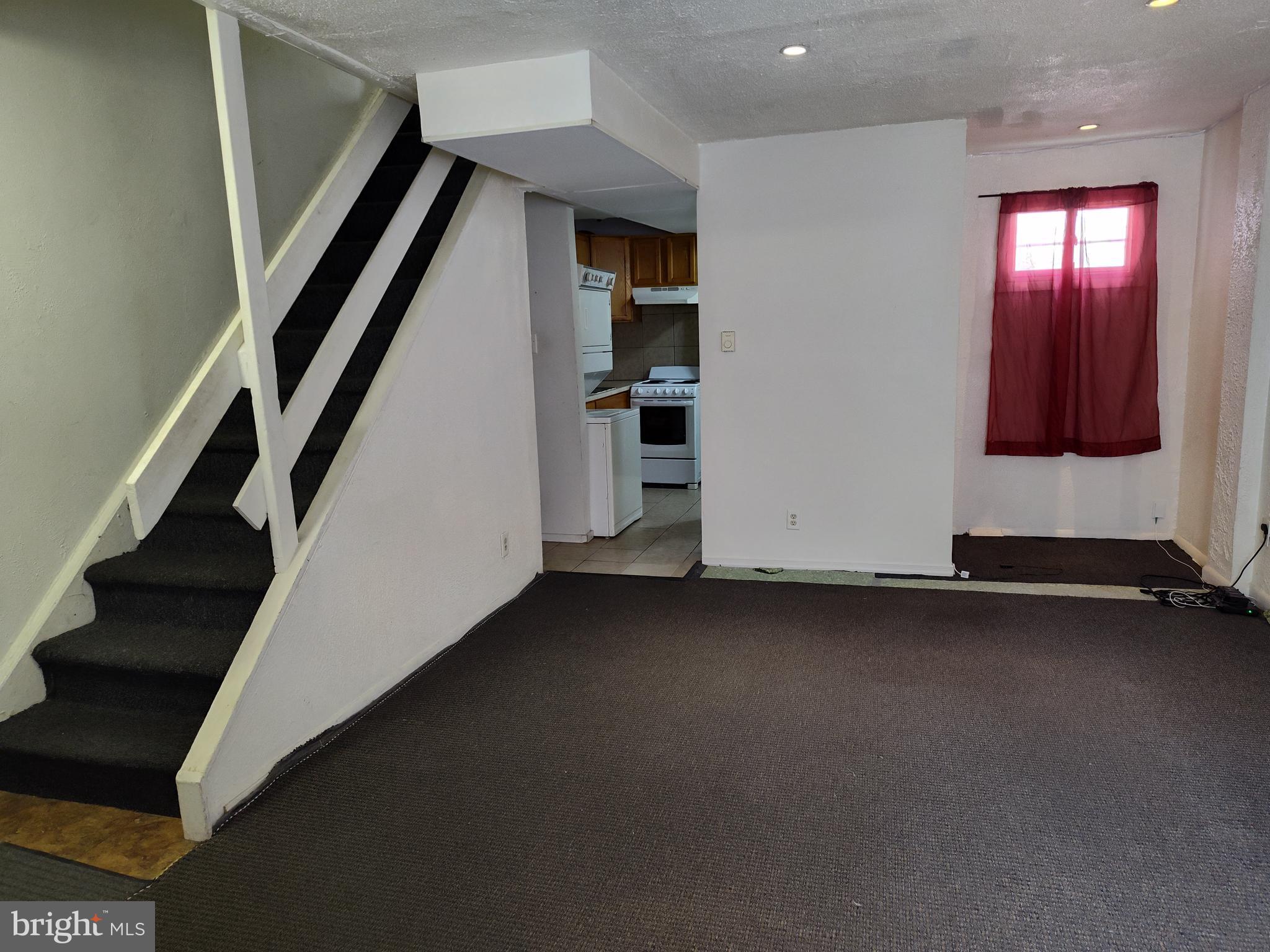 1607 Page Street Philadelphia, PA 19121 - Photo 9 of 14 an empty room with staircase