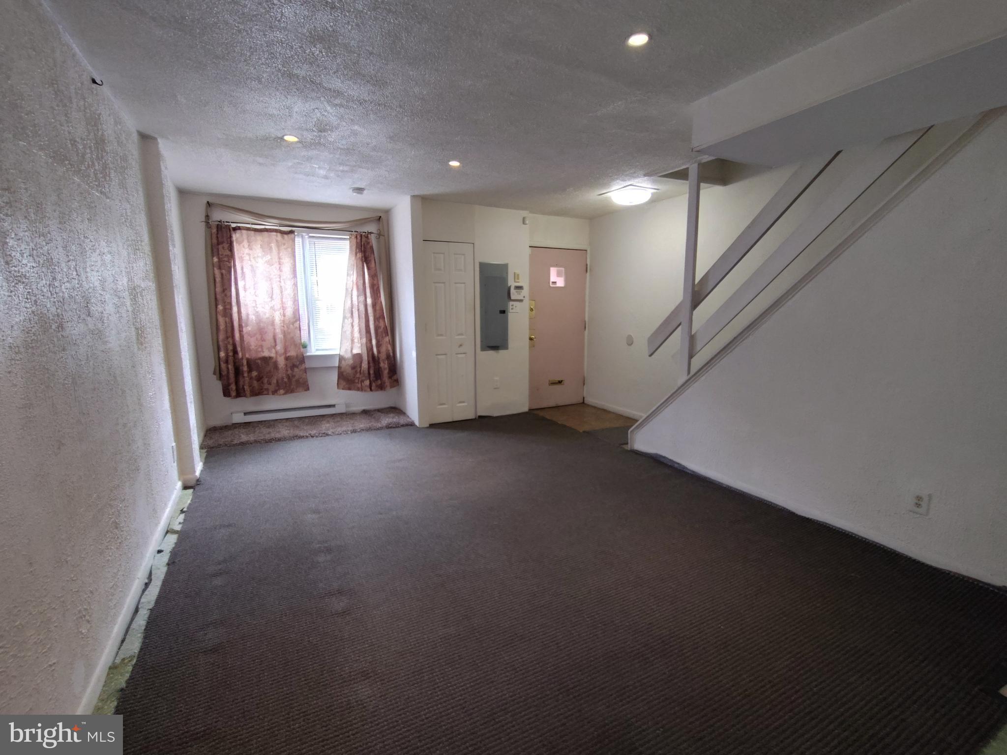 1607 Page Street Philadelphia, PA 19121 - Photo 10 of 14 an empty room with windows and closet