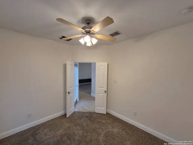 a view of wooden house with a yard
