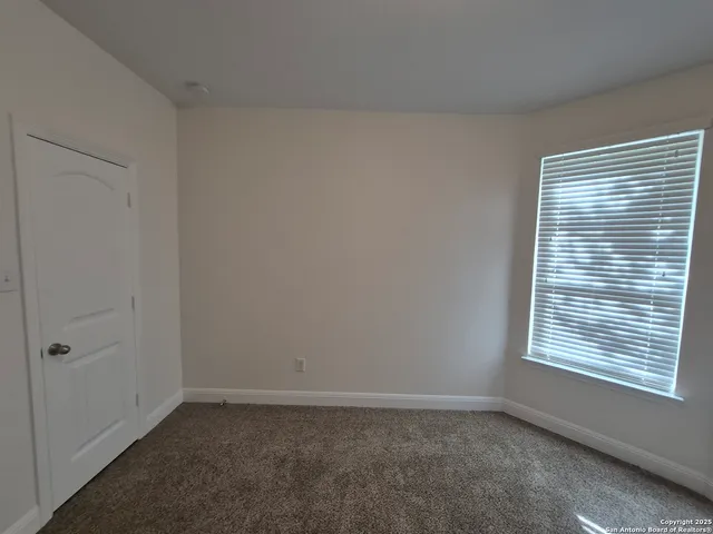 a bathroom with a toilet and a bathtub
