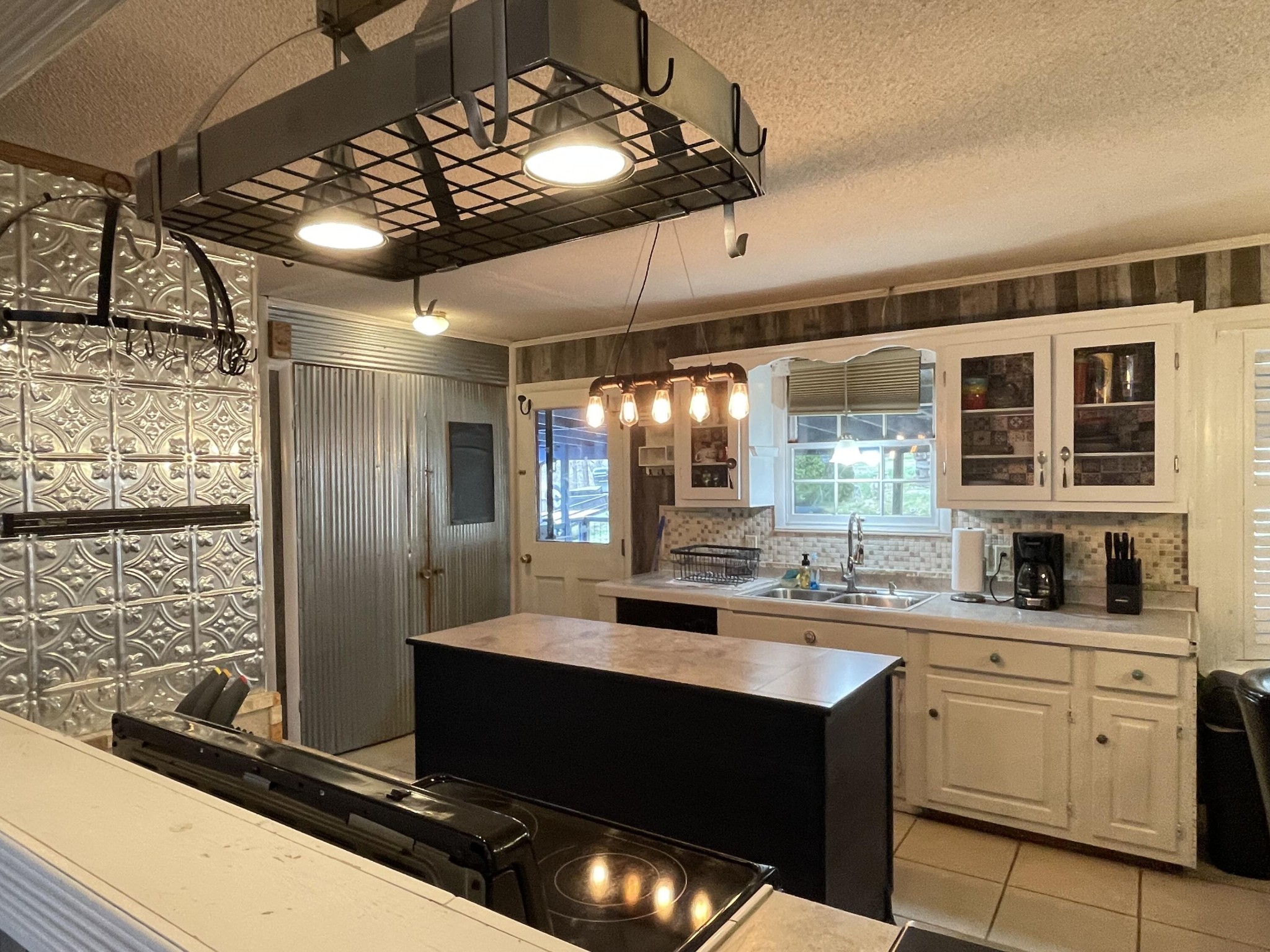 1522 Turkey Creek Road Tellico Plains, TN 37385 - Photo 29 of 34 a kitchen with a sink stainless steel appliances and cabinets