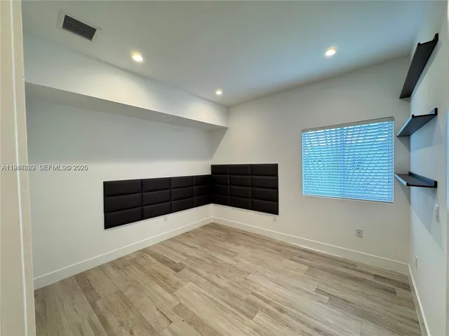 a room with furniture and wooden floor