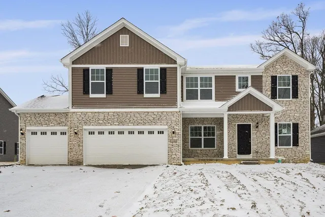front view of a house with a yard
