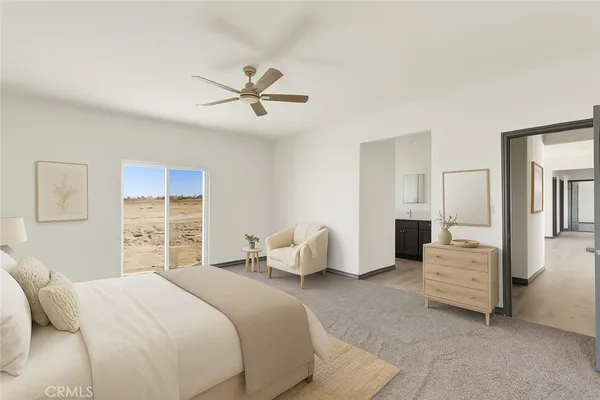 a bedroom with a bed and ceiling fan