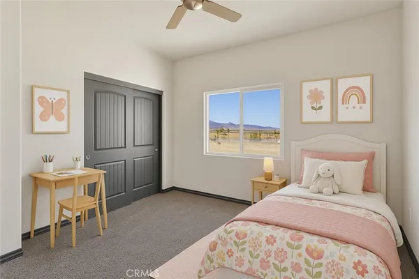 a bedroom with a bed and a table in it
