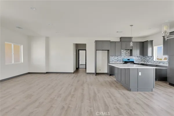 a view of kitchen with wooden floor