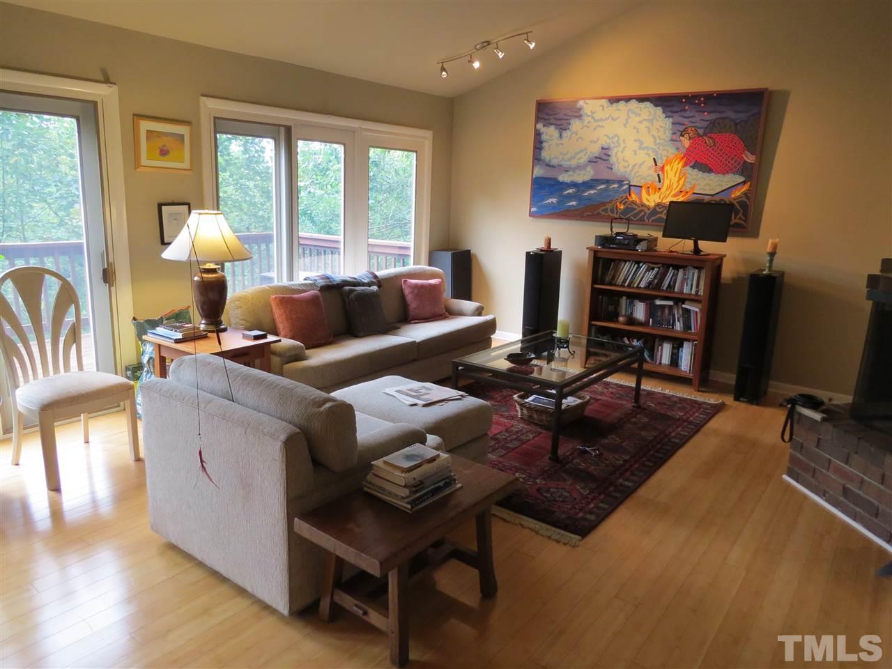 4308 Azalea Drive Raleigh, NC 27612 - Photo 2 of 18 a living room with fireplace furniture and a flat screen tv