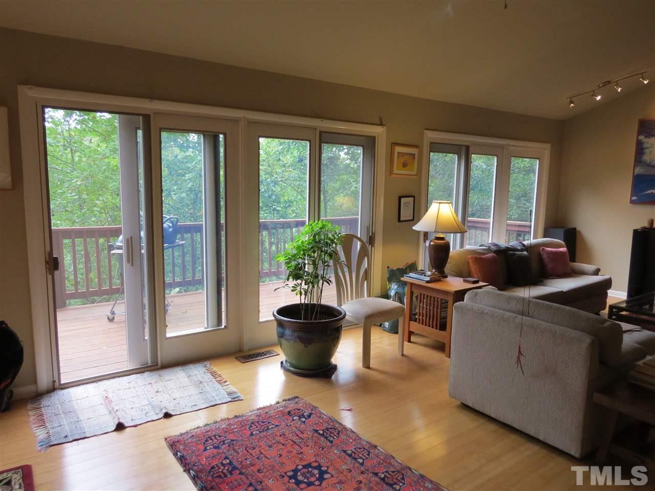 4308 Azalea Drive Raleigh, NC 27612 - Photo 3 of 18 a living room with furniture and a potted plant