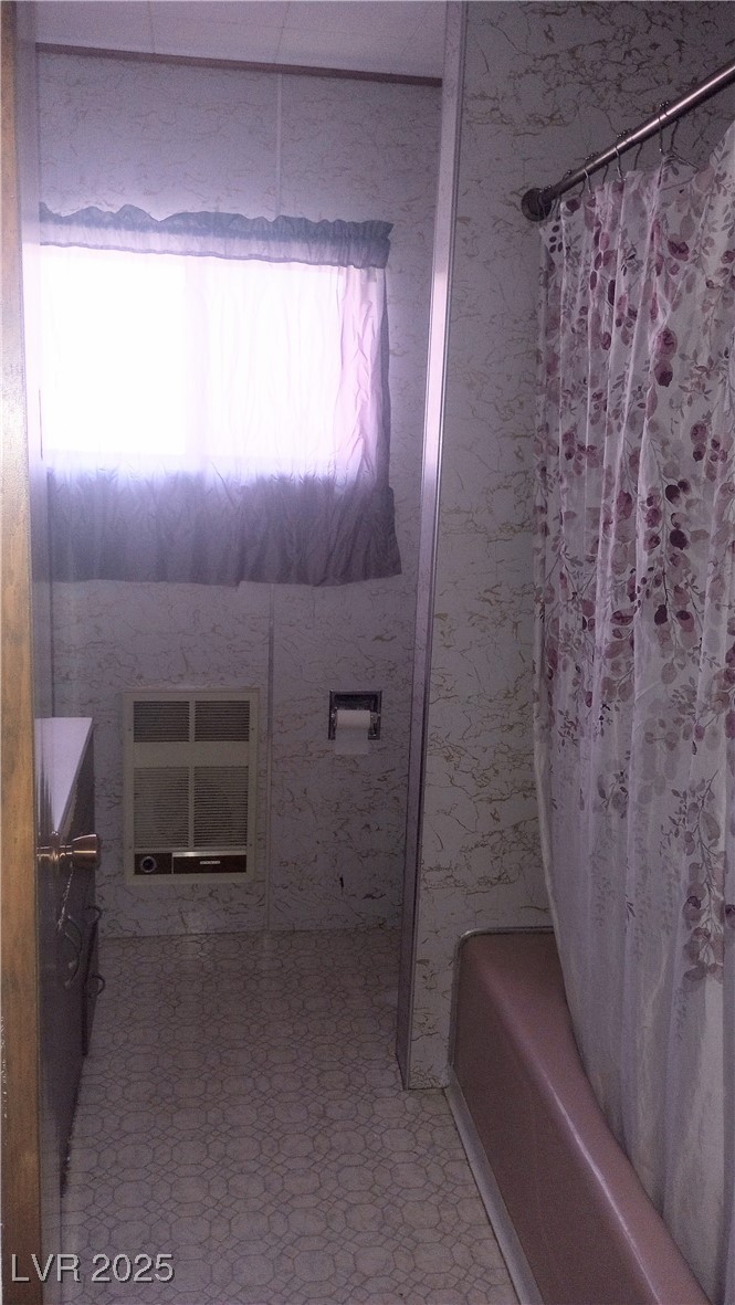 168 Lilith Avenue Pioche, NV 89043 - Photo 10 of 13 Bathroom with shower / tub combo and tile patterned floors